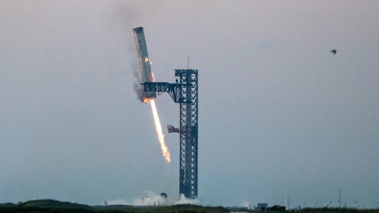 WATCH: SpaceX Successfully Uses Mechazilla Arms To Catch Super Heavy Rocket