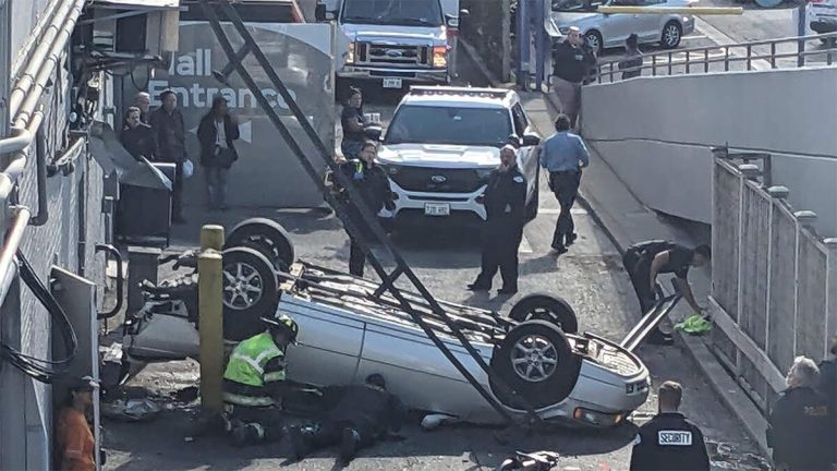 Car Flips Over After Driver Plunges Off Parking Garage Onto Street Below