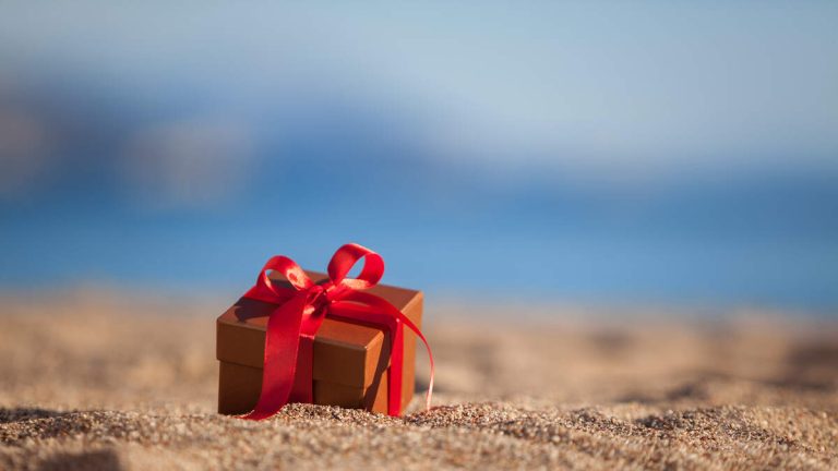 Man Makes Horrific Discovery Inside Gift-Wrapped Box On The Beach