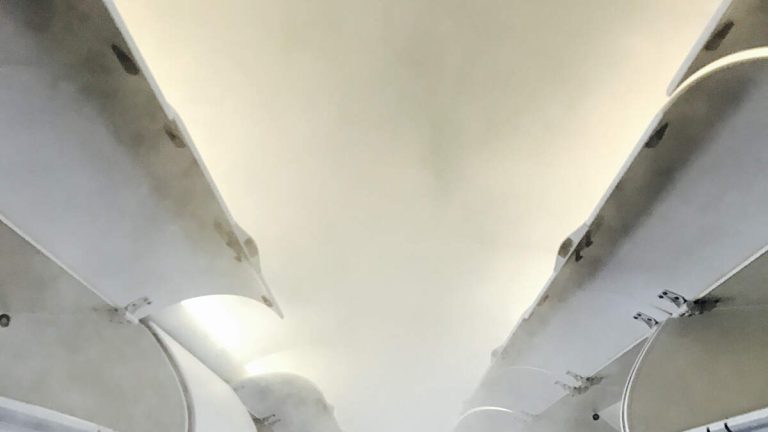 Passengers Stop To Grab Carry-Ons As Plane Is Being Evacuated Due To Smoke