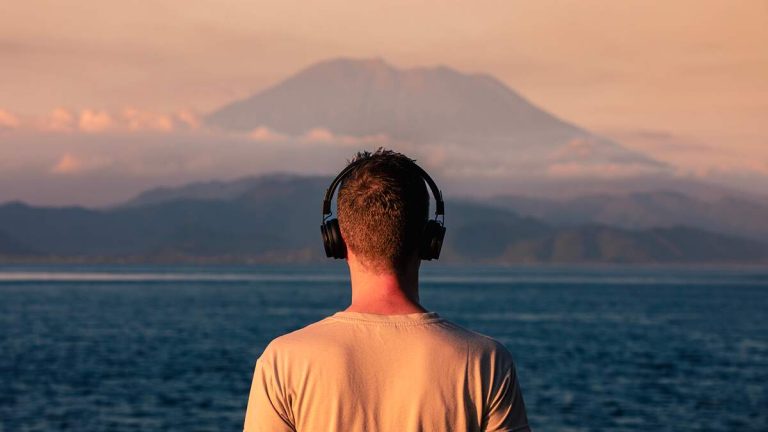 The Best Travel Podcasts To Listen To