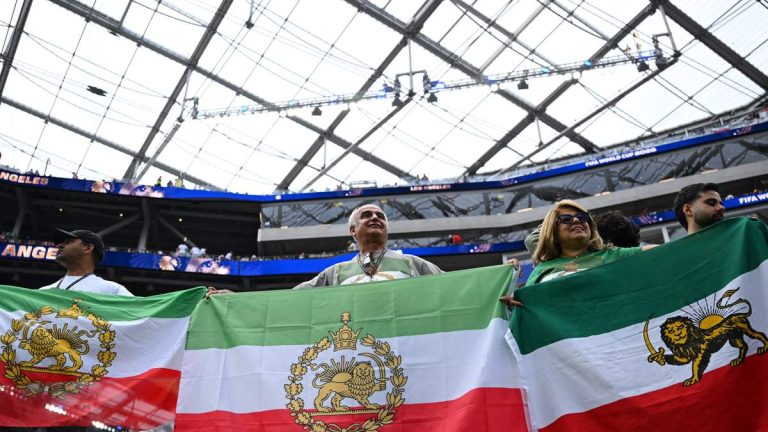 Iranian Fans Bring Lion-And-Sun Flags To World Cup Match Despite FIFA Ban